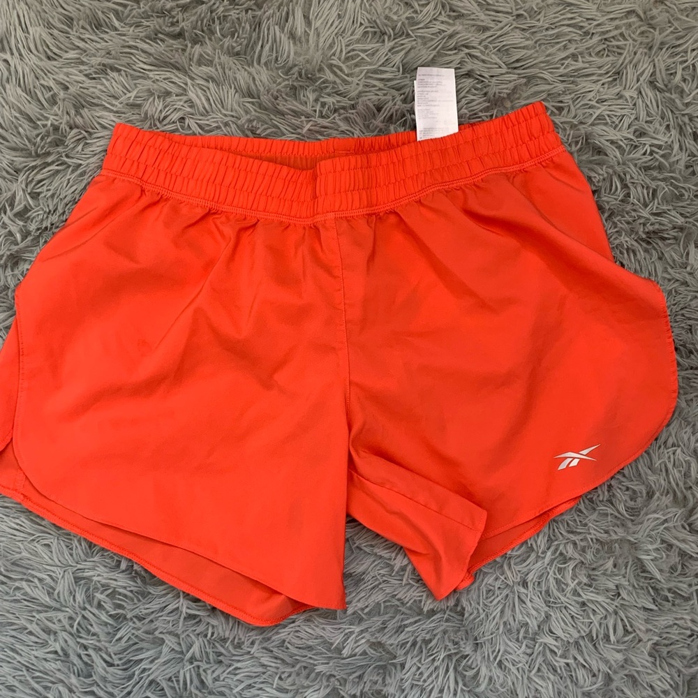 Neon orange Reebok active shorts